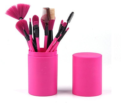 12 piece makeup brush set in vibrant pink holder featuring various brushes for flawless application