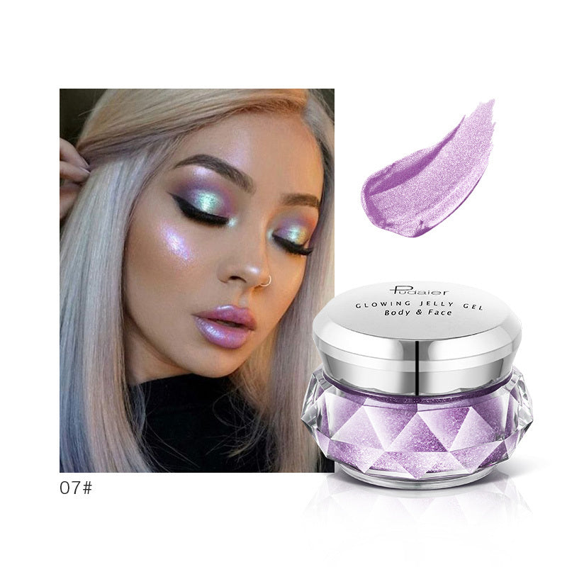 Bella Bliss Cosmetics Mermaid Face Highlighter Gel in a shimmering purple jar with a swatch on a model's cheek